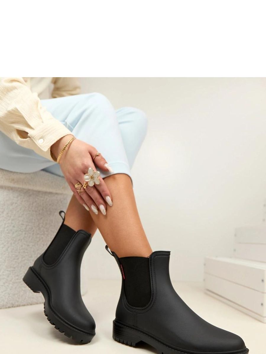 Bottes de pluie noires en caoutchouc pour femme, vue de profil