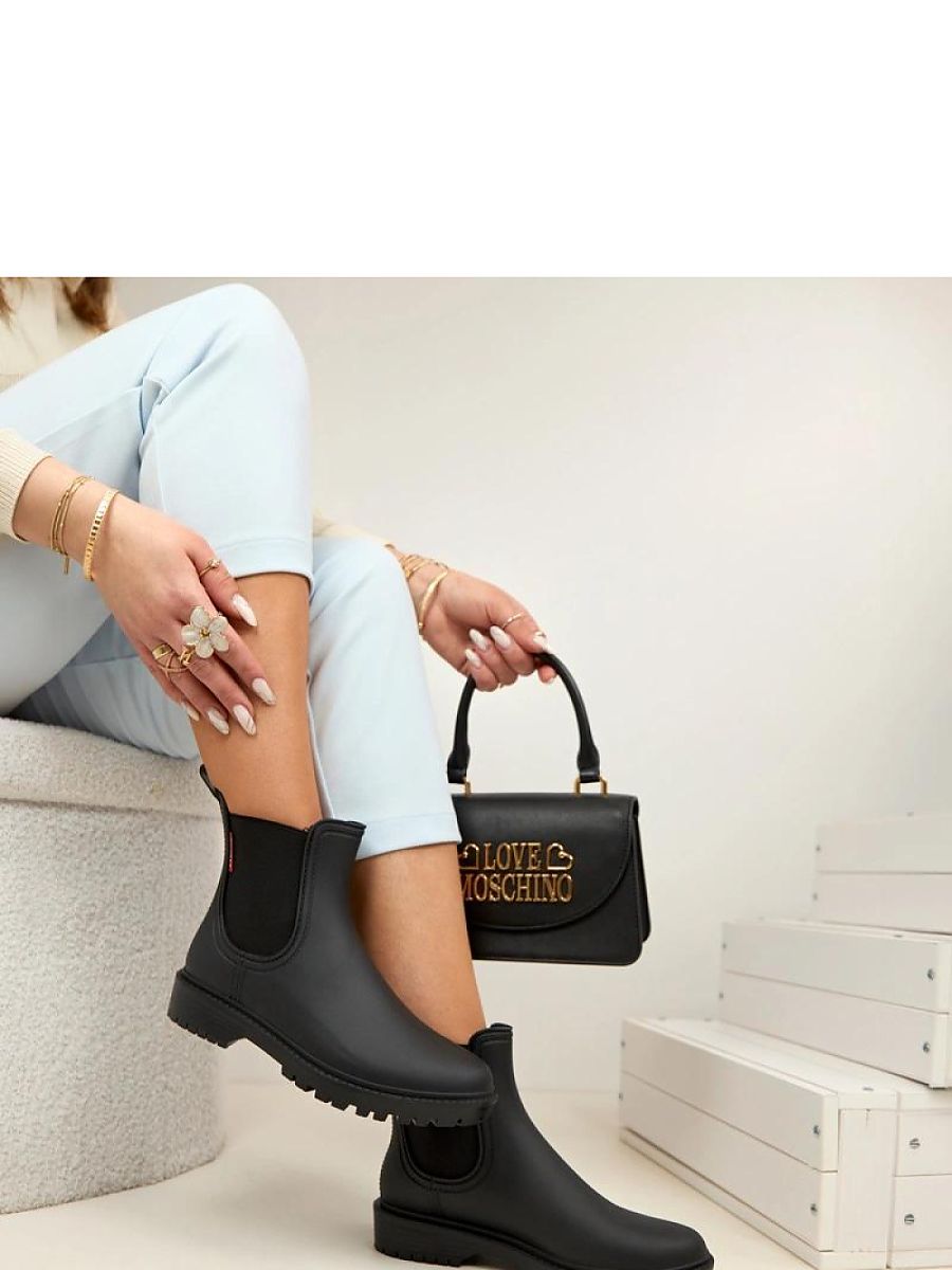 Bottes de pluie noires en caoutchouc pour femme, vue de profil — vue 2